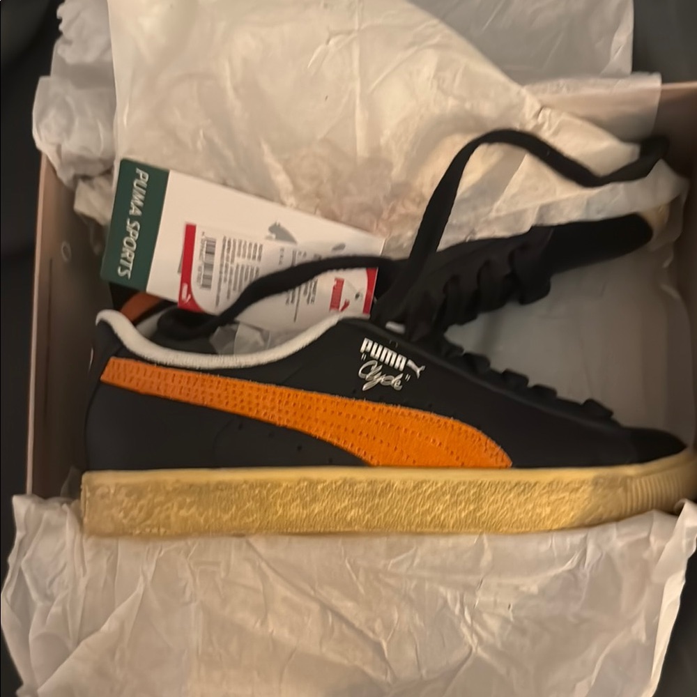 Puma Clyde Black and Orange Sneakers